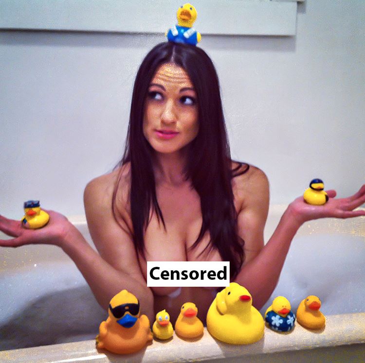 naked girl in bath with rubber duckies 